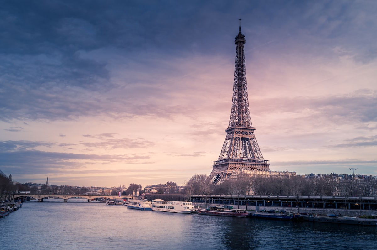 View of the Eiffel Tower in Paris at sunset with golden light