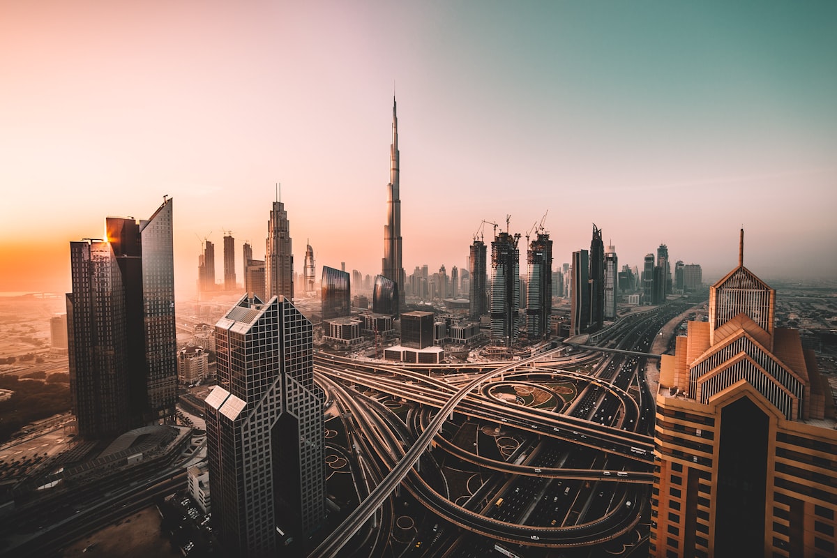 Dubai skyline at sunset with the Burj Khalifa towering over the city